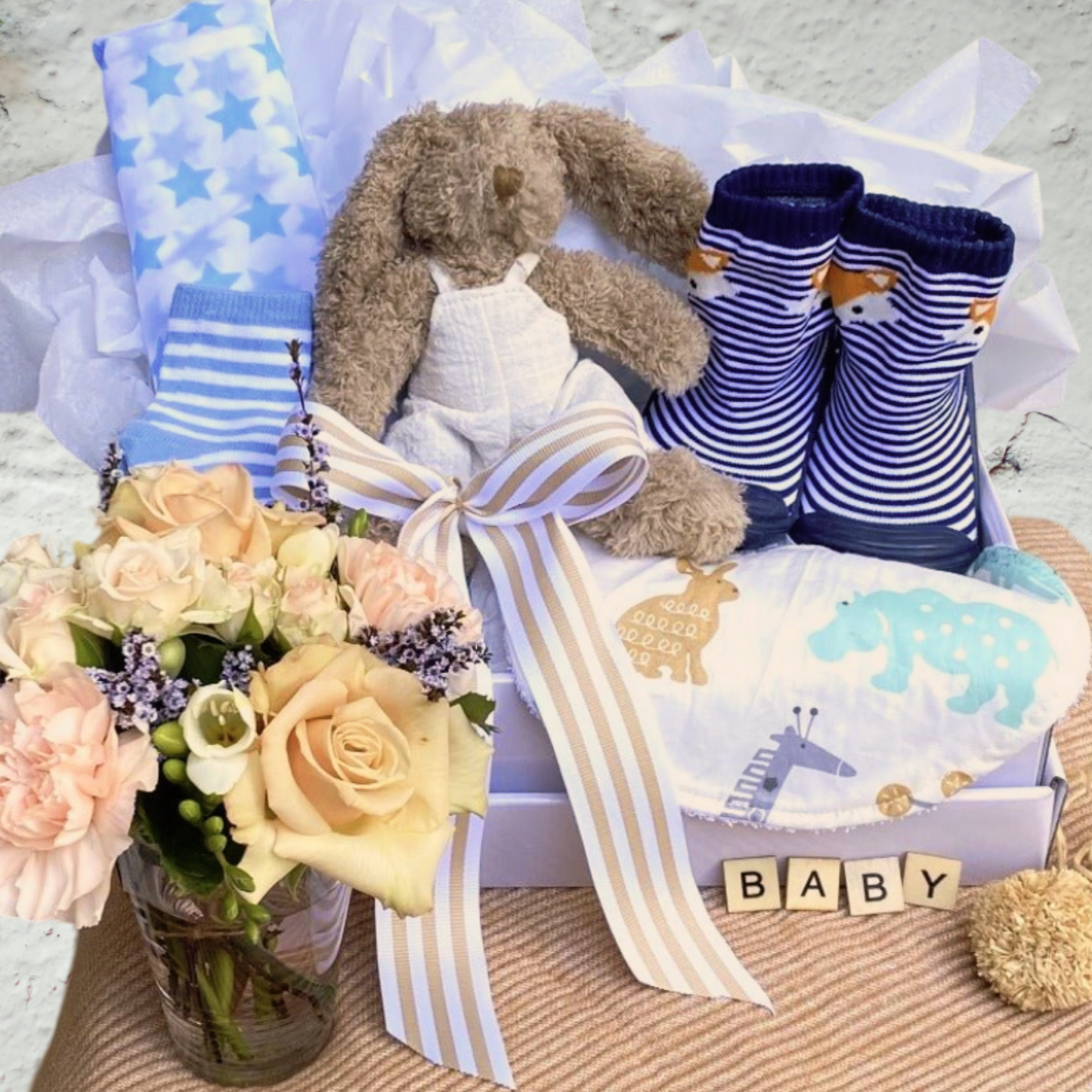 Small vase of flowers with Baby hamper in blue inc soft toy