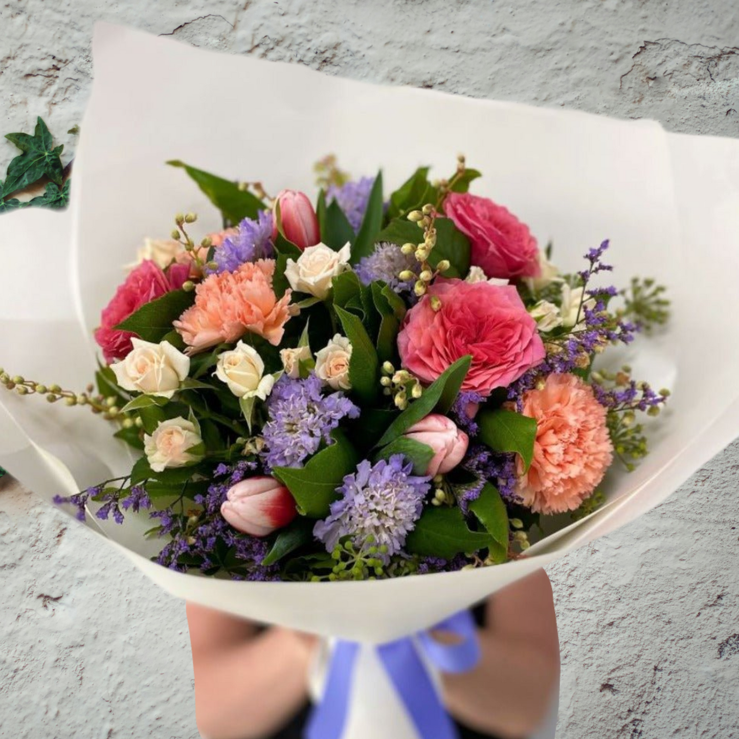 Seasonal Flowers presented as a posy gift wrapped