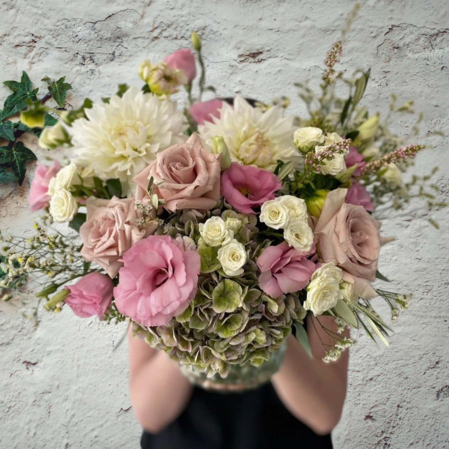 Seasonal pastel flowers presented in vase