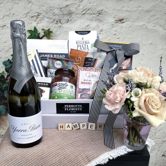 Wine, Flowers and hamper of gourmet food items