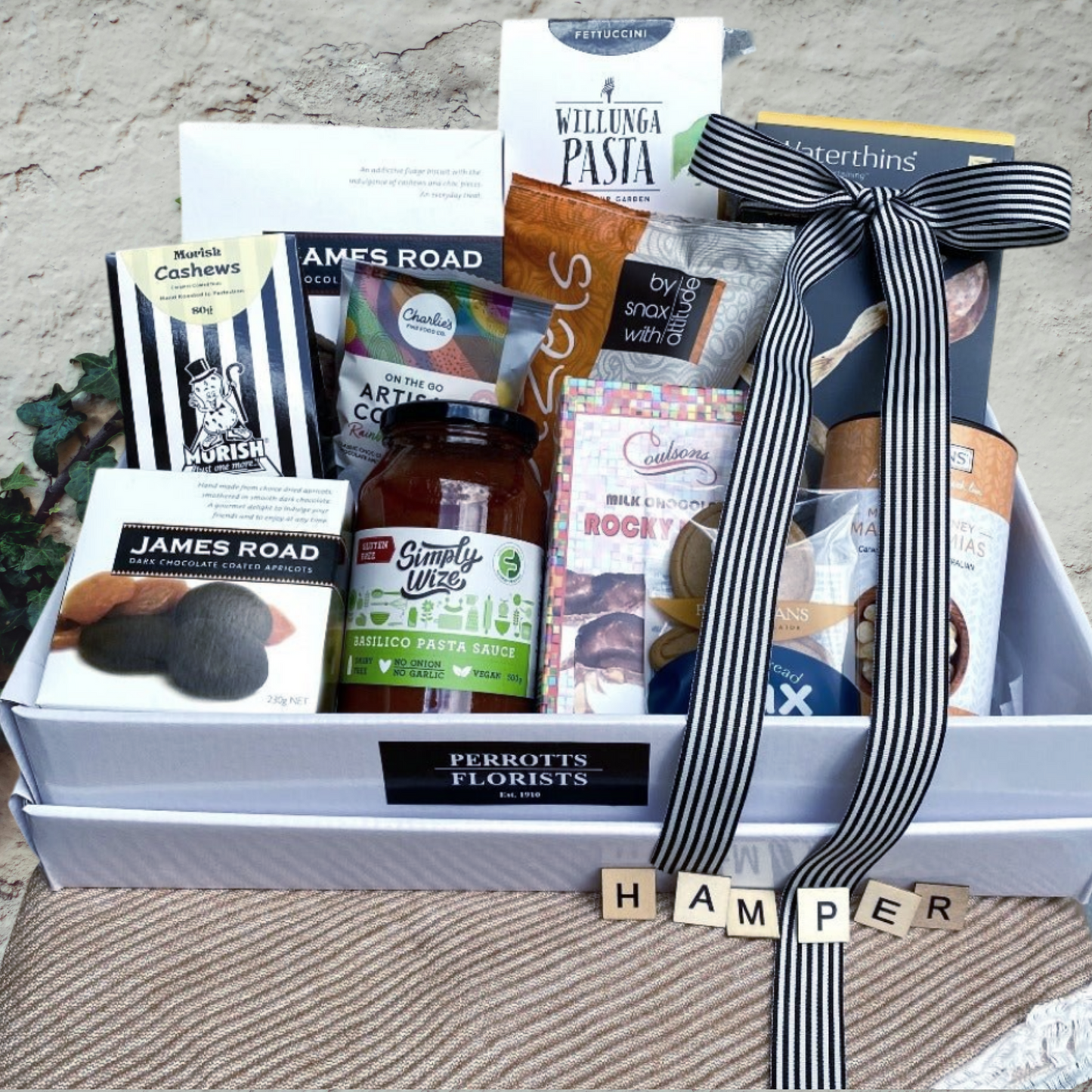 Selection of Gourmet food items presented in hamper